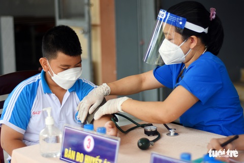 Đồng Nai bắt đầu tiêm vắc xin phòng COVID-19 cho trẻ 5-11 tuổi - Ảnh 3. Đồng Nai bắt đầu tiêm vắc xin phòng COVID-19 cho trẻ 5-11 tuổi - Ảnh 3.