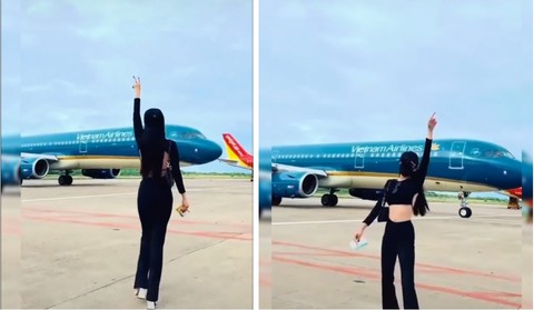 Cô gái nhảy múa gần máy bay đang lăn vào sân đỗ: Có thể bị hút vào động cơ - Ảnh 1. Cô gái nhảy múa gần máy bay đang lăn vào sân đỗ: Có thể bị hút vào động cơ - Ảnh 1.