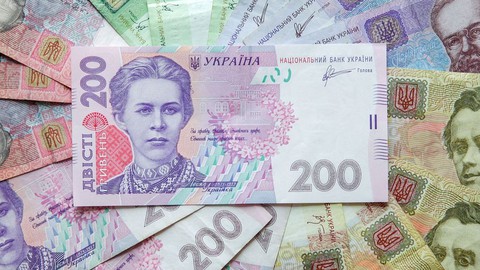 Ukraine hạ giá đồng nội tệ 25% để bảo vệ dự trữ ngoại hối - Ảnh 1. Ukraine hạ giá đồng nội tệ 25% để bảo vệ dự trữ ngoại hối - Ảnh 1.