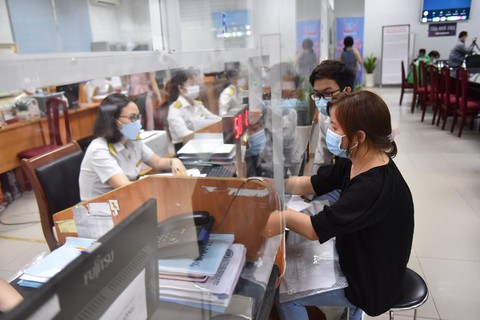 Năm 2022 thu thuế cán mốc hơn 1,4 triệu tỉ đồng, vượt 24,3% so với dự toán - Ảnh 1. Năm 2022 thu thuế cán mốc hơn 1,4 triệu tỉ đồng, vượt 24,3% so với dự toán - Ảnh 1.