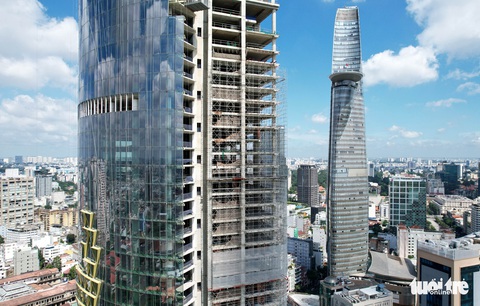 Tòa nhà chọc trời ‘làm xấu bộ mặt TP.HCM hơn 10 năm có chủ mới, đổi tên thành IFC One Saigon - Ảnh 2. Tòa nhà chọc trời ‘làm xấu bộ mặt TP.HCM hơn 10 năm có chủ mới, đổi tên thành IFC One Saigon - Ảnh 2.