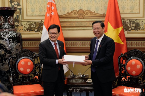 Singapore muốn hỗ trợ TP.HCM xây dựng trung tâm tài chính tầm thế giới - Ảnh 2. Singapore muốn hỗ trợ TP.HCM xây dựng trung tâm tài chính tầm thế giới - Ảnh 2.