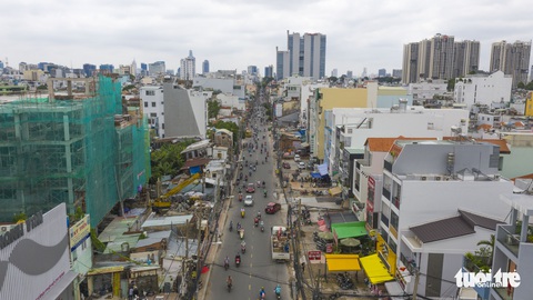 Những người tiên phong bàn giao mặt bằng cho tuyến metro - Ảnh 2. Những người tiên phong bàn giao mặt bằng cho tuyến metro - Ảnh 2.