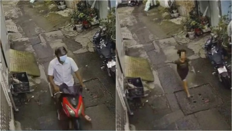 Bắt nghi phạm cướp giật điện thoại của bé trai ở quận 12 - Ảnh 1. Camera ghi lại hình ảnh bé trai chạy bộ đuổi theo Thành chạy xe máy trong hẻm - Ảnh cắt từ video