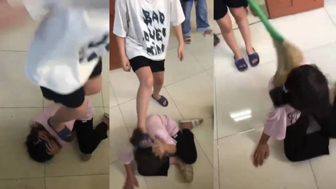 Vụ nữ sinh lớp 6 bị đánh hội đồng, dùng chổi quét lên đầu: Phê bình ban giám hiệu - Ảnh 1. Nữ sinh bị đánh hội đồng sau giờ tan học - Ảnh chụp từ clip