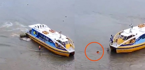 Nhân viên buýt sông giải cứu người phụ nữ vừa nhảy cầu Sài Gòn - Ảnh 1. Các nhân viên buýt sông chạy từ bến Bình An ra giữa sông Sài Gòn để cứu người - Ảnh cắt từ clip