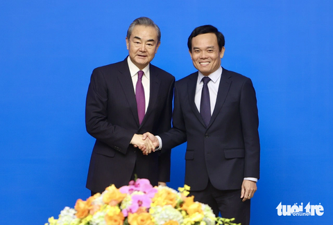 Đề nghị Trung Quốc tăng thông quan, mở cửa thị trường cho hàng hóa Việt Nam- Ảnh 1. Phó thủ tướng Trần Lưu Quang và Ngoại trưởng Trung Quốc Vương Nghị tại cuộc họp ngày 1-12 - Ảnh: NGUYỄN KHÁNH