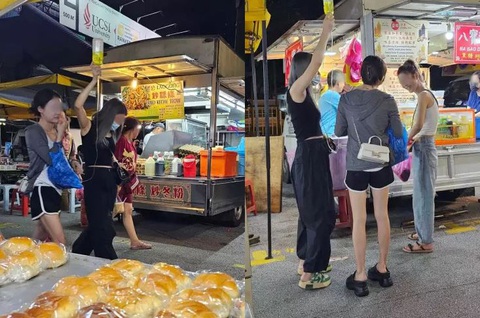 Cô gái dạo chợ đêm cùng chai truyền dịch- Ảnh 1. Nhóm bạn trở thành tâm điểm của buổi dạo chợ đêm khi có chai truyền dịch.