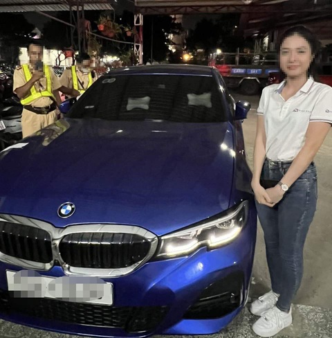 Cô gái lái BMW lên tới 140km/h ở Thủ Đức khai với cảnh sát là... muốn thử xe- Ảnh 1. Cô gái chạy xe BMW quá tốc độ làm việc với lực lượng chức năng, chiêc xe của cô này cũng bị tạm giữ 7 ngày - Ảnh: M.H.