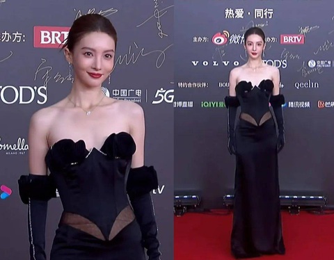 Kim Thần Kim Thần - người đã dũng cảm thử nghiệm nhiều phong cách khác nhau trên thảm đỏ - lần này kết hợp mái tóc ôm sát da đầu cùng chiếc váy đen dài, thiết kế có điểm nhấn ở eo giúp dáng người trông cao ráo và thon thả.