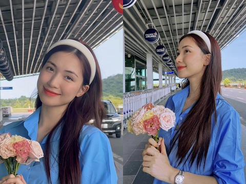 Ảnh vui sao Việt 8-4: Hoa hậu Thùy Tiên ngồi 'bá đạo' khi bán rau - Ảnh 2. Ca sĩ Hòa Minzy bắt trend chụp ảnh ôm hoa của Lưu Diệc Phi.