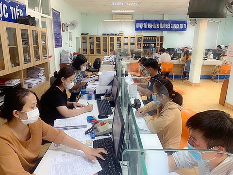 Người dân làm thủ tục bảo hiểm xã hội - Ảnh: BHXH TP.HCM Người dân làm thủ tục bảo hiểm xã hội - Ảnh: BHXH TP.HCM