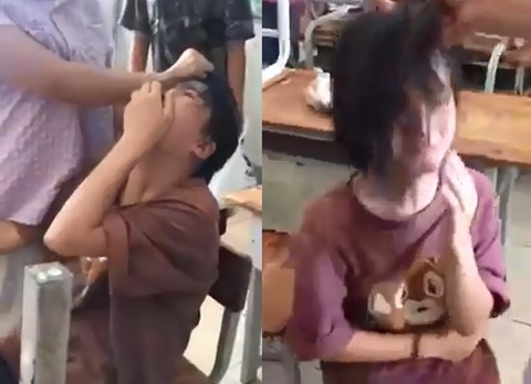 Học sinh lớp 5 bị nữ sinh lớp 7 túm tóc, tát trong lớp học - Ảnh 1. Học sinh lớp 5 bị nữ sinh lớp 7 túm tóc, tát trong lớp học - Ảnh 1.