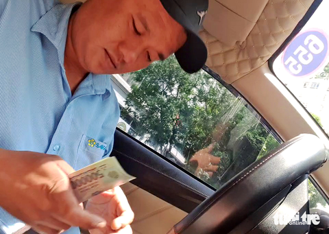 Hãng Saigontourist taxi lên tiếng sau vụ tài xế gắn thiết bị gian lận cước - Ảnh 2. Hãng Saigontourist taxi lên tiếng sau vụ tài xế gắn thiết bị gian lận cước - Ảnh 2.