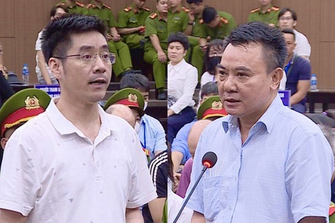 Cựu phó giám đốc Công an Hà Nội: 'Là một thằng tù cũng phải có nhân cách' - Ảnh 1. Bị cáo Hoàng Văn Hưng (trái) và bị cáo Nguyễn Anh Tuấn đối đáp tại tòa - Ảnh: NAM ANH