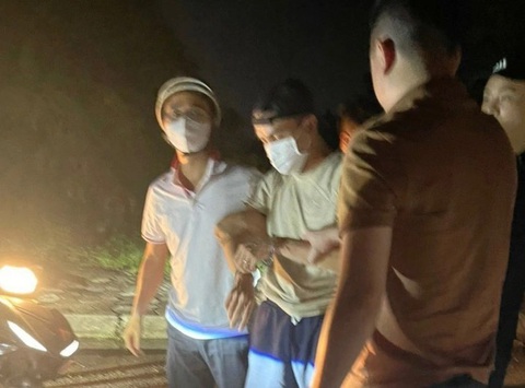 Nghi phạm bắt cóc bé trai 7 tuổi là cảnh sát giao thông - Ảnh 1. Nguyễn Đức Trung thời điểm bị bắt - Ảnh: TTXVN