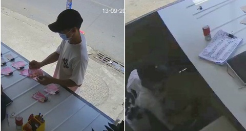 Người bán vé số ở Hóc Môn bị trộm hơn 200 tờ vé số và 7,5 triệu đồng - Ảnh 1. Nam thanh niên đến quầy mua vé số, sau đó trở lại lẻn vào quầy trộm tài sản - Ảnh cắt từ clip do camera ghi lại