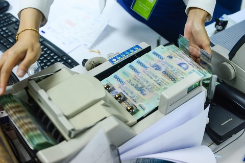 Xuất hiện ngân hàng báo lỗ đầu tiên, TPBank lãi cũng 'bốc hơi' mạnh- Ảnh 1. Lợi nhuận ngân hàng năm 2023 dự báo phân hóa mạnh - Ảnh: QUANG ĐỊNH