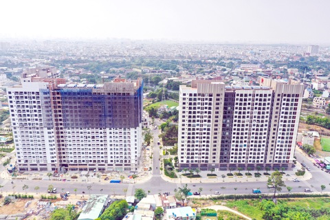 Luật Đất đai 2024: Nhà nước - Dự án nhà ở thương mại đang được xây dựng tại quận 12, TP.HCM - Ảnh: QUANG ĐỊNH