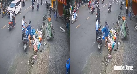Đoạn đường Phan Văn Trị ở quận Bình Thạnh như bãi rác, nhiều người đến vứt bậy- Ảnh 3. Một người phụ nữ vứt rác bậy bị