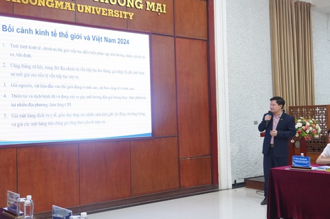Các vụ mất tiền trong tài khoản ngân hàng là thách thức cho chuyển đổi số- Ảnh 1. Công bố báo cáo thường niên kinh tế và thương mại - Ảnh: N.AN