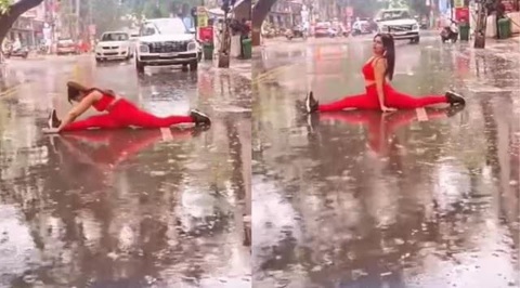 Ra giữa đường nhảy múa 'đu trend' bất chấp, người ta có vậy không?- Ảnh 1. Ảnh cắt từ clip ghi lại cảnh một phụ nữ đang tập yoga giữa đường để quay phim ở thành phố Rajkot, bang Gujarat, Ấn Độ - Ảnh: Indian Express