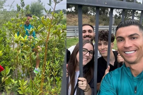 Ronaldo lách qua bụi cây để selfie với fan- Ảnh 1. Ronaldo nhiệt tình với fan đến mức nhiều người bất ngờ.