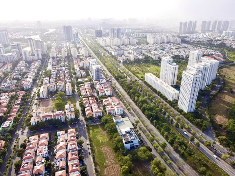 Bảng giá đất điều chỉnh tác động đến ai?- Ảnh 1. Bảng giá đất mới sẽ sát giá thị trường so với trước đây. Trong ảnh: một khu dân cư ở quận 7, TP.HCM - Ảnh: T.T.D.