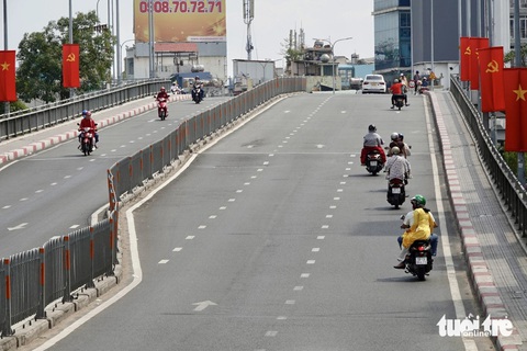Mùng 1 Tết TP.HCM đường xá bình yên đến lạ - Ảnh 5. Mùng 1 Tết đường sá TP.HCM bình yên đến lạ - Ảnh 5.
