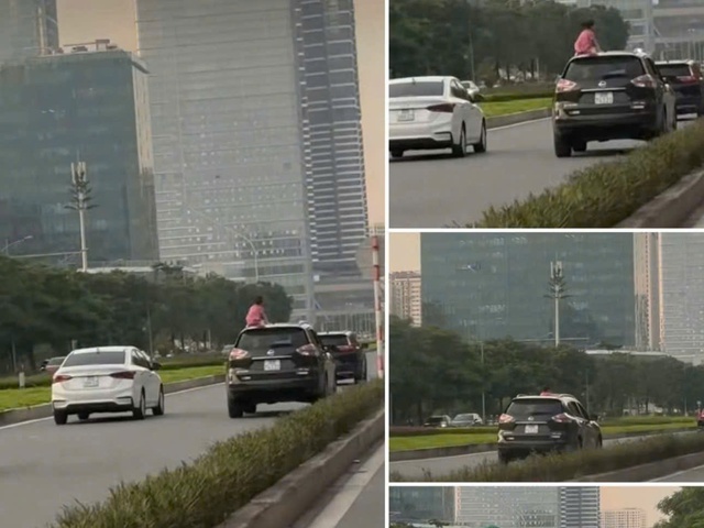 Hanoi driver fined after child seen on roof of moving car - Ảnh 2.