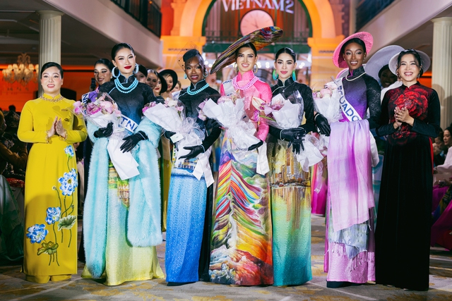 Thí sinh Miss Cosmo 2025 hào hứng khi diện áo dài Việt Nam - Ảnh 11.