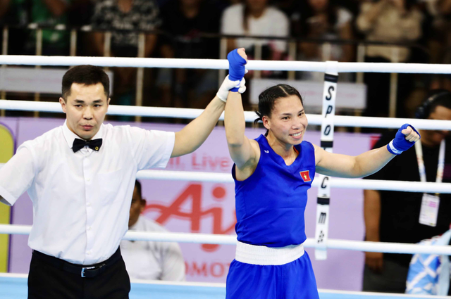 Vietnamese mother of 2 wins boxing gold at 33rd SEA Games - Ảnh 1.