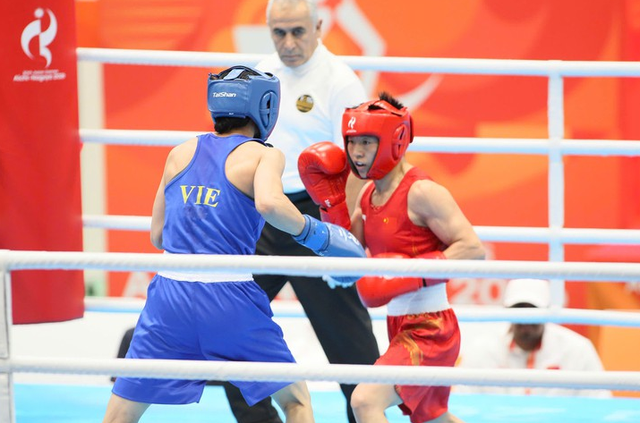 Vietnamese boxer wins historic silver at Asiad- Ảnh 1.