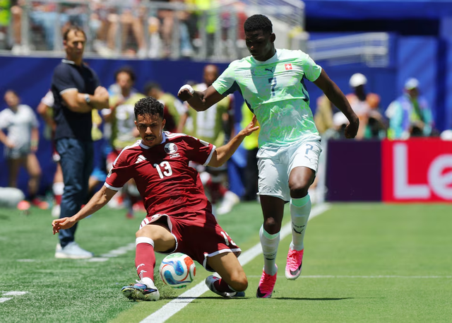 Qatar hail first World Cup point after late goal stuns Switzerland in 1-1 draw- Ảnh 4. Qatar hail first World Cup point after late goal stuns Switzerland in 1-1 draw- Ảnh 4.