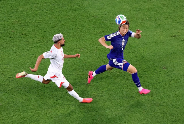 Japan rout Tunisia 4-0 as Ueda shines in World Cup's 1,000th match- Ảnh 1. Japan rout Tunisia 4-0 as Ueda shines in World Cup's 1,000th match- Ảnh 1.