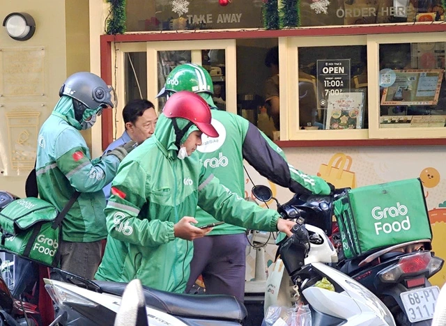 Vietnam fines Grab over $51,000 for consumer rights violations - Ảnh 1.
