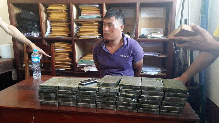 Cất vó chuyên án 911LV, bắt 40 bánh heroin - Ảnh 1. Cất vó chuyên án 911LV, bắt 40 bánh heroin - Ảnh 1.