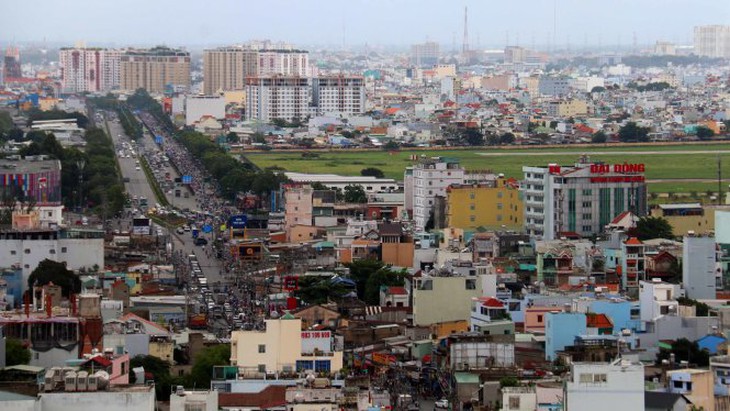 Ngày 19-10, Bộ Quốc phòng bàn giao đất ven đường Trường Chinh - Ảnh 1.