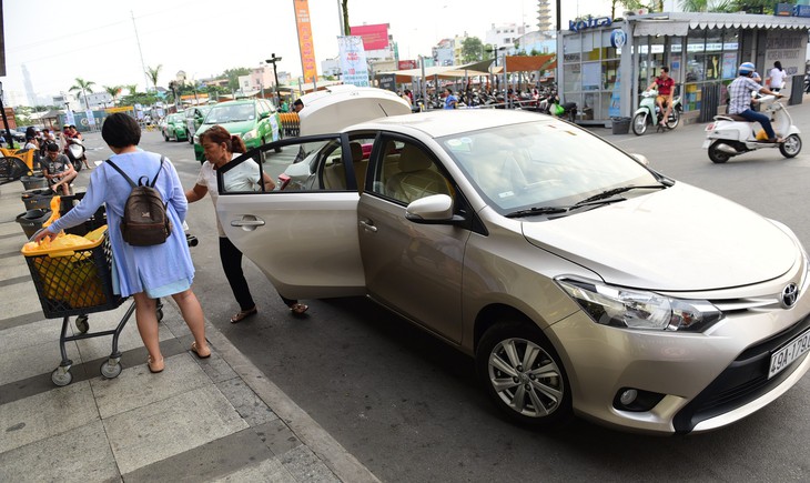 Có phải đền bù khi gây hư hỏng xe taxi Grab? - Ảnh 1.