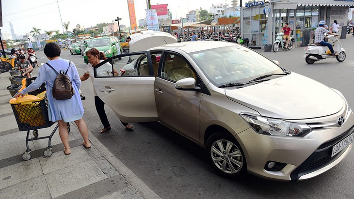 Khi Uber, Grab là doanh nghiệp vận tải - Ảnh 1.