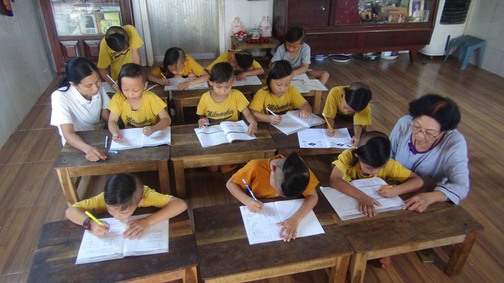 Người bà của 26 đứa cháu - Ảnh 1. Người bà của 26 đứa cháu - Ảnh 1.