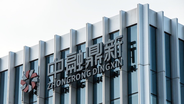 "Khoảnh khắc Lehman" có xảy ra ở Trung Quốc? - Ảnh 1. Văn phòng của Công ty Zhongrong International Trust trong ảnh chụp tại Bắc Kinh (Trung Quốc) vào ngày 14-8 - Ảnh: Bloomberg