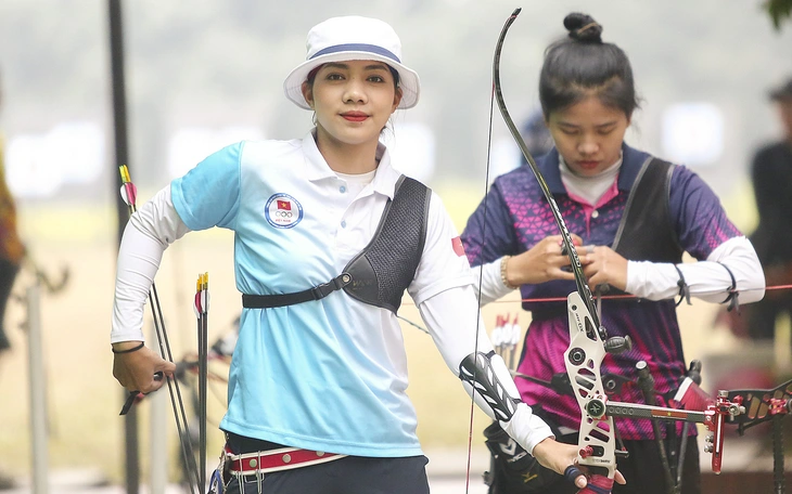 Đứng bắn giữa nắng chiều 32 độ C, cung thủ Việt Nam vào tranh HCV - Ảnh 10.