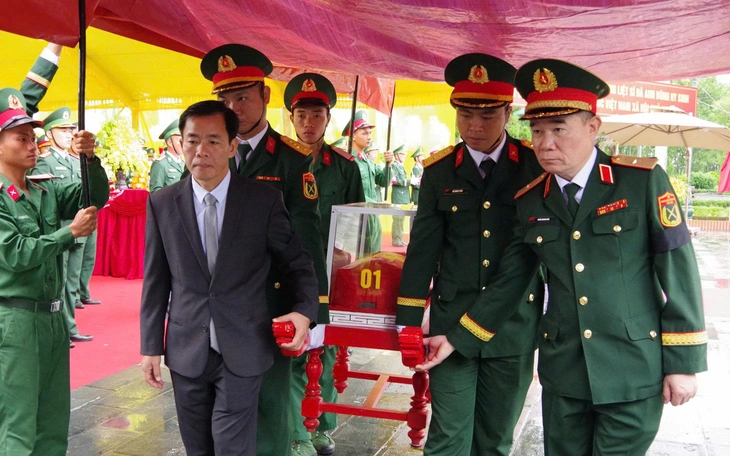 Phát hiện 2 hài cốt liệt sĩ kèm di vật khắc chữ SH 1-99X - Ảnh 3.