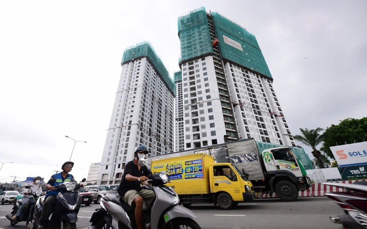 Bộ Xây dựng: Không để tiền sử dụng đất đẩy giá nhà tăng cao - Ảnh 3.