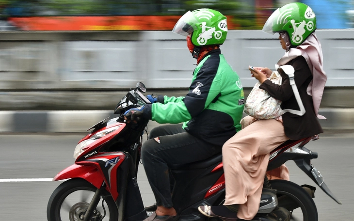 Cái giá để Grab và GoTo được ở lại Indonesia - Ảnh 2.