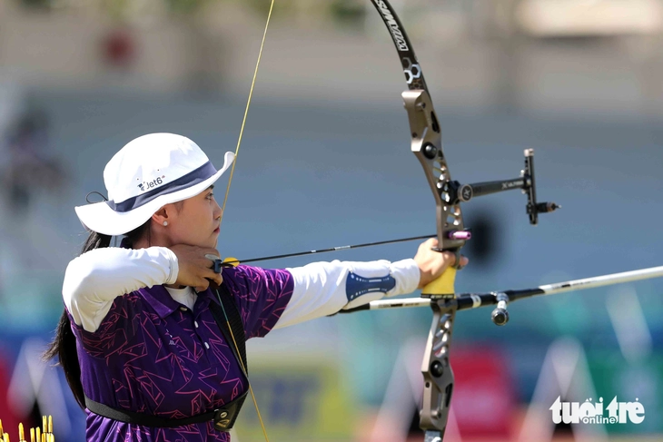 Đứng bắn giữa nắng chiều 32 độ C, cung thủ Việt Nam vào tranh HCV - Ảnh 8.