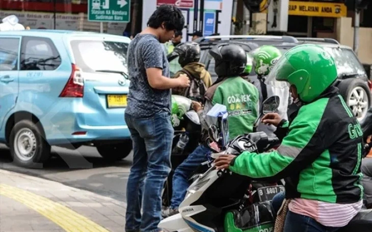 Indonesia mở đường cho siêu sáp nhập Grab - GoTo - Ảnh 2.