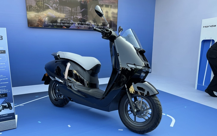 Honda làm xe máy điện giá rẻ, pin có thể tháo rời đặt trong 'bình xăng' - Ảnh 5.