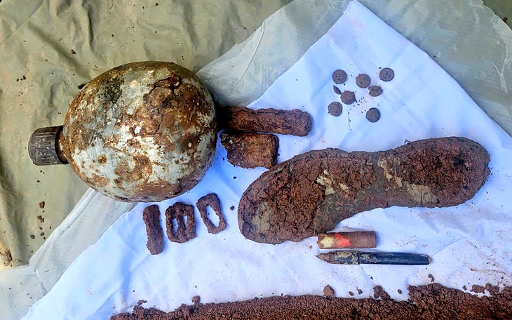 Phát hiện hài cốt liệt sĩ cùng lọ thủy tinh có tên NGUYỄN MINH THUẬN - Ảnh 2.